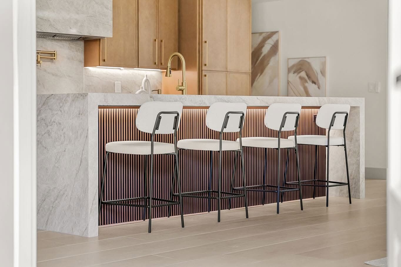 Kitchen island with pendant lighting and custom cabinetry inside Chris's design center ecosystem