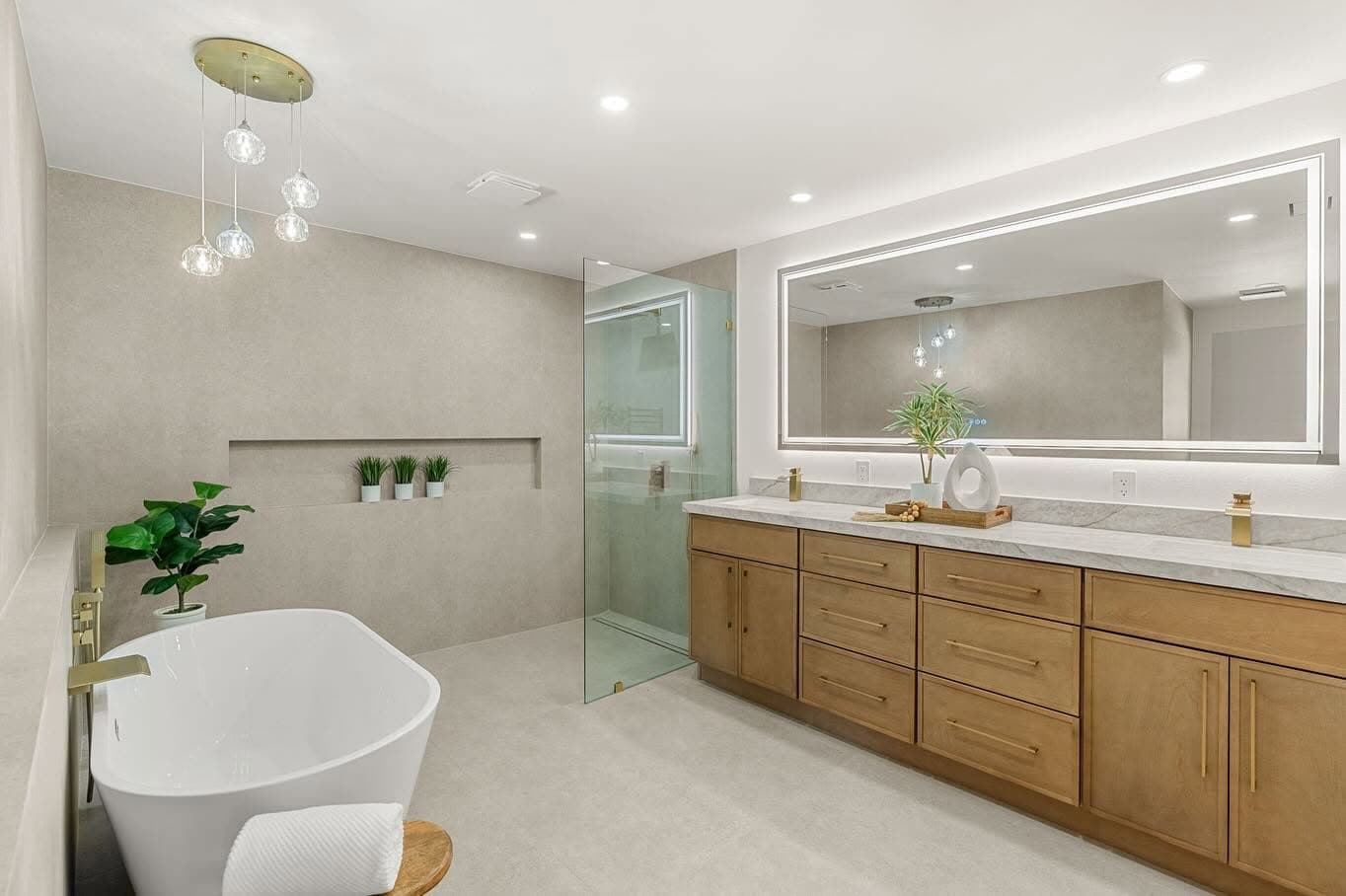 Primary bathroom with freestanding tub and glass shower
